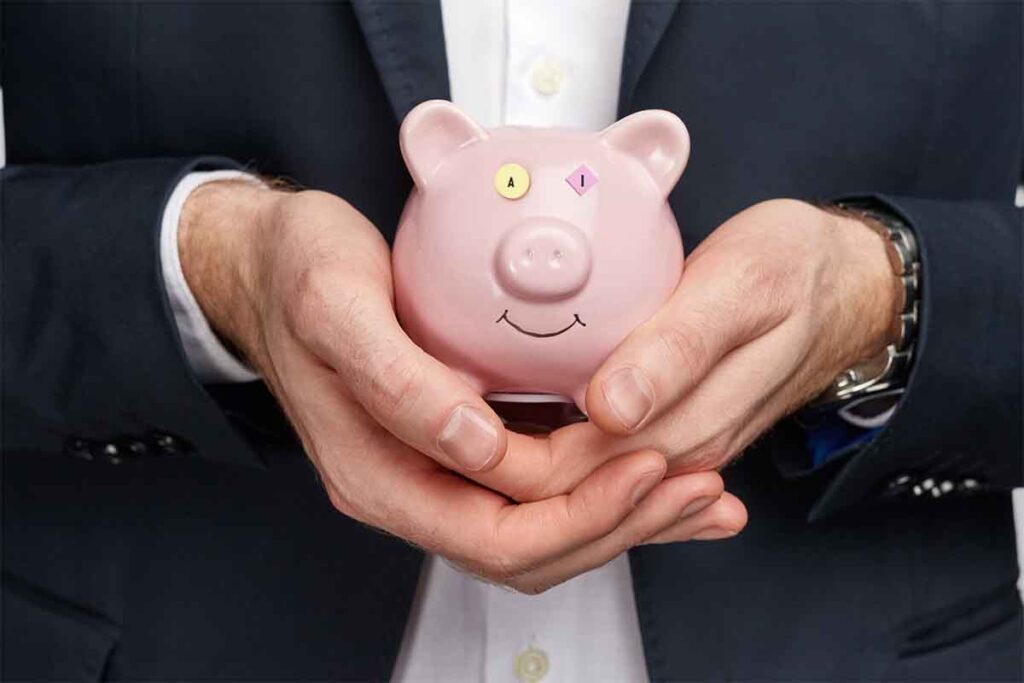 Photo illustration of a piggybank with a person in a suit.