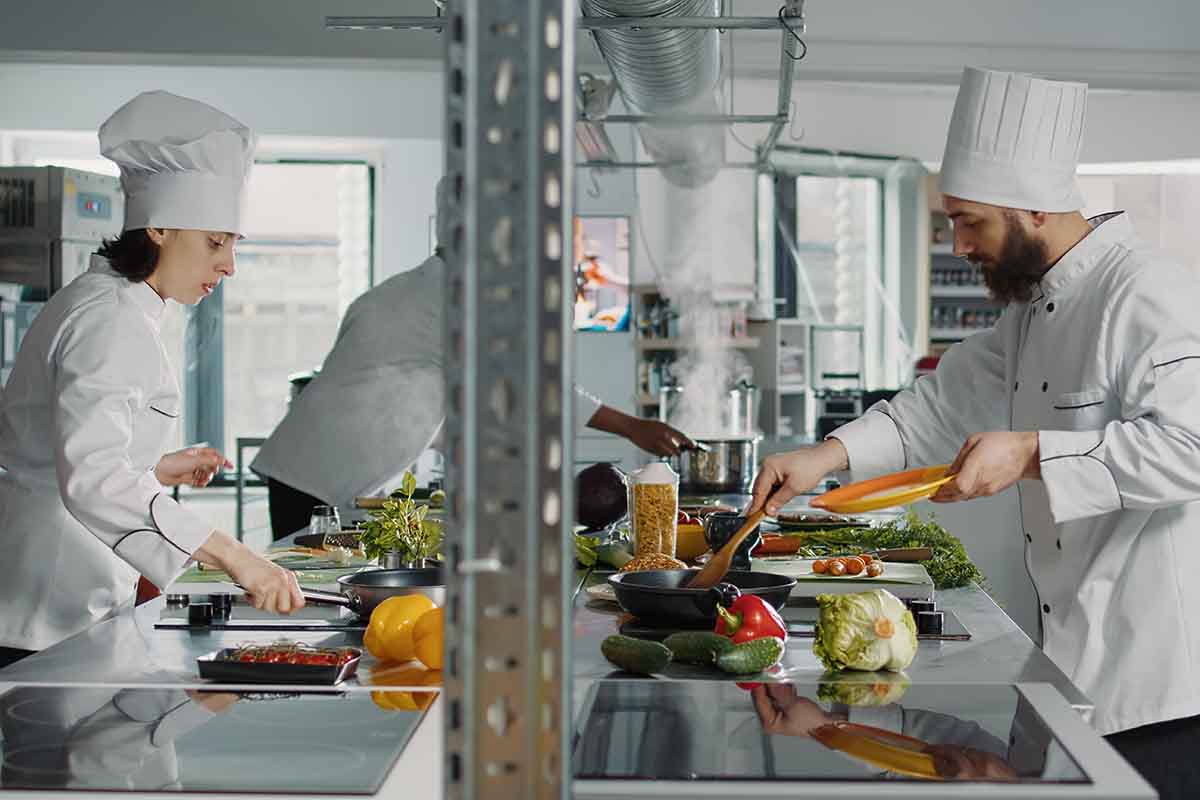 People cooking in a restaurant.