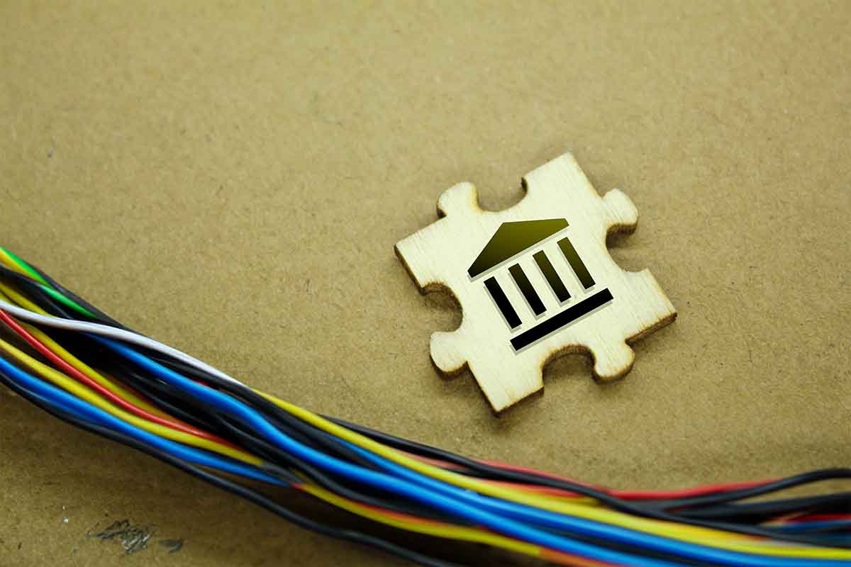 Generative AI photo illustration showing digital banking with wires, a puzzle piece with a bank icon.